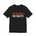Black Dance Dads t-shirt printed with "ASK ME ABOUT THE FOUETTÉ" in burnt orange and white across the chest