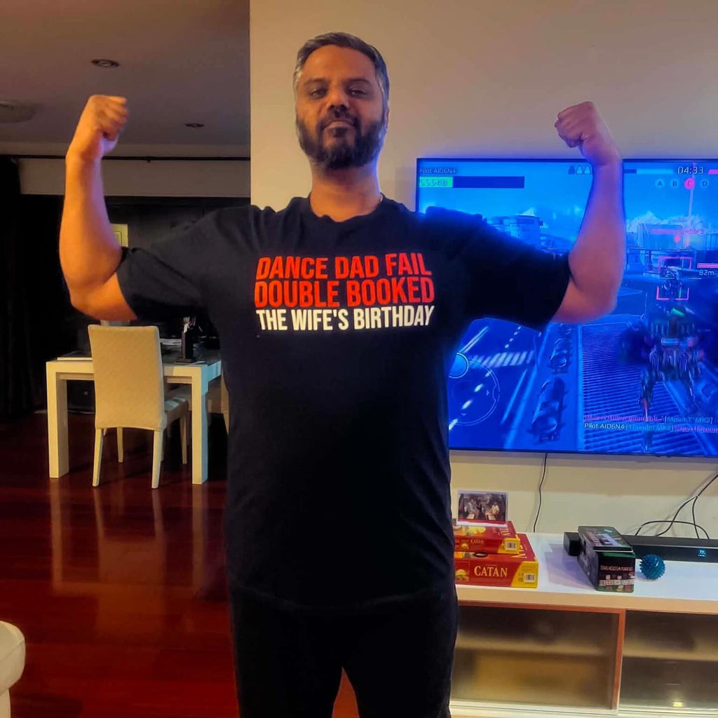 Our first customer flexing in his custom black tee that reads Dance Dad Fail, Double Booked, The Wife's Birthday