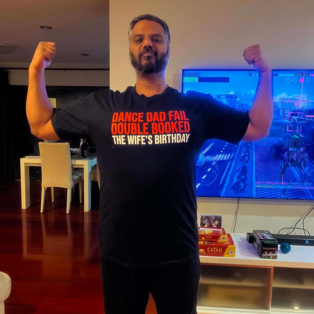 Our first customer flexing in his custom black tee that reads Dance Dad Fail, Double Booked, The Wife's Birthday