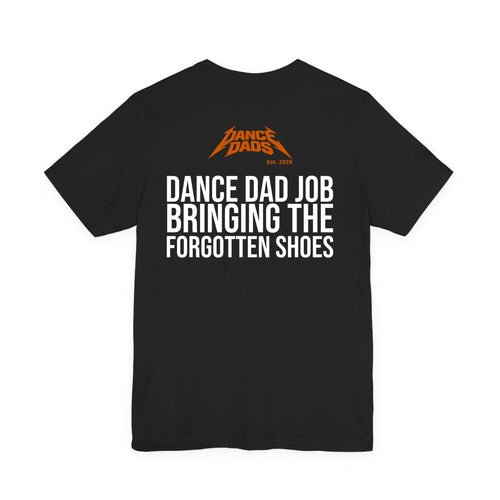 Black Dance Dads tee with "Dance Dad Job: Bringing The Forgotten Shoes" printed across the back